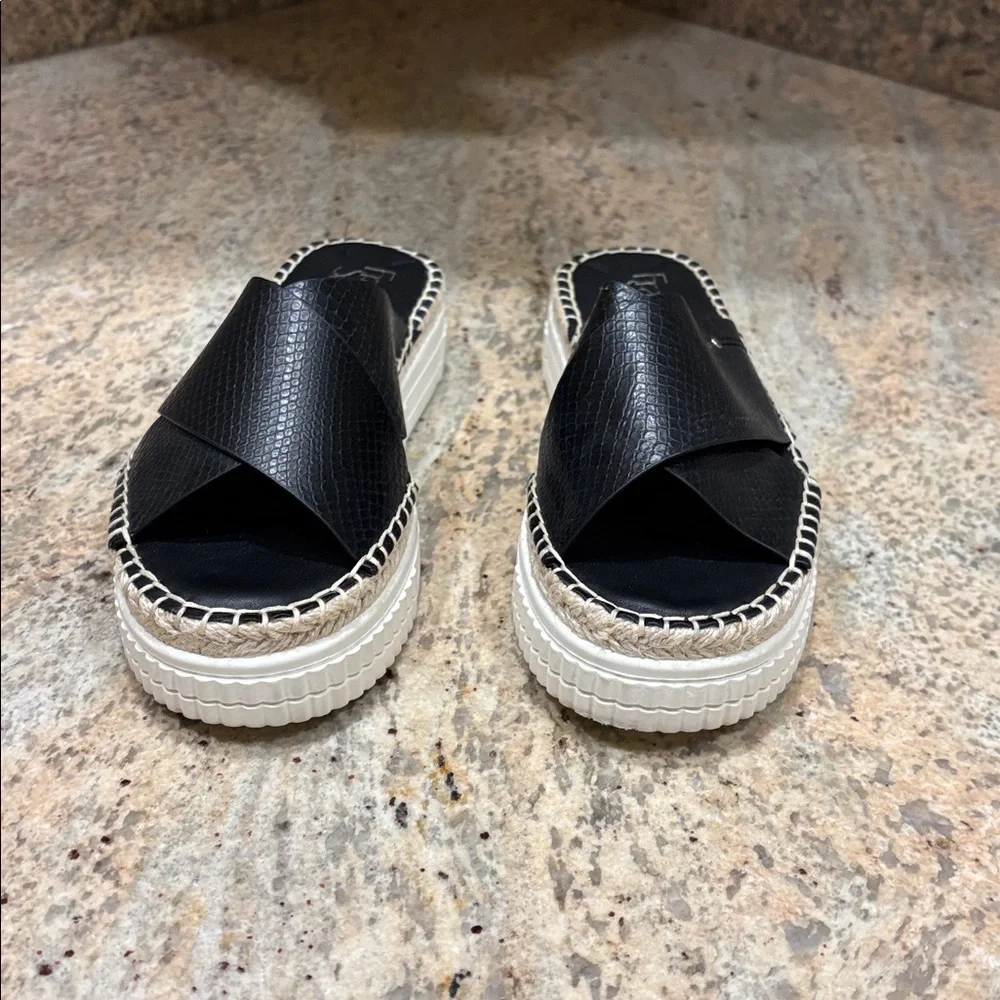 Franco Sarto Black Espadrille Slides. They are a woman's size 6